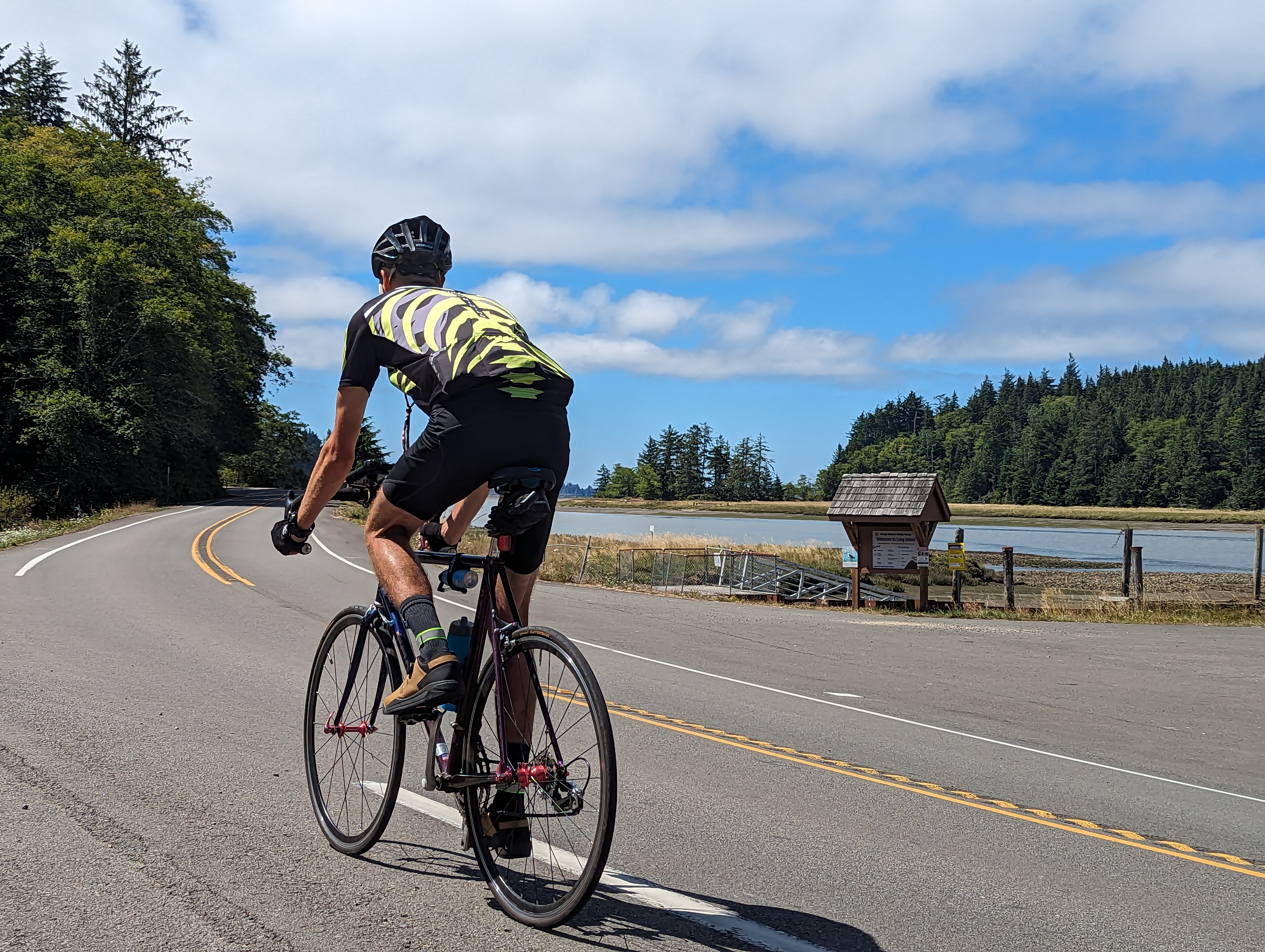 A rider prepares to turn left into the rest stop at Willapa Bay National Wildlife Refuge.